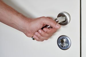 Professional London locksmith inspecting a lock in Knightsbridge SW7